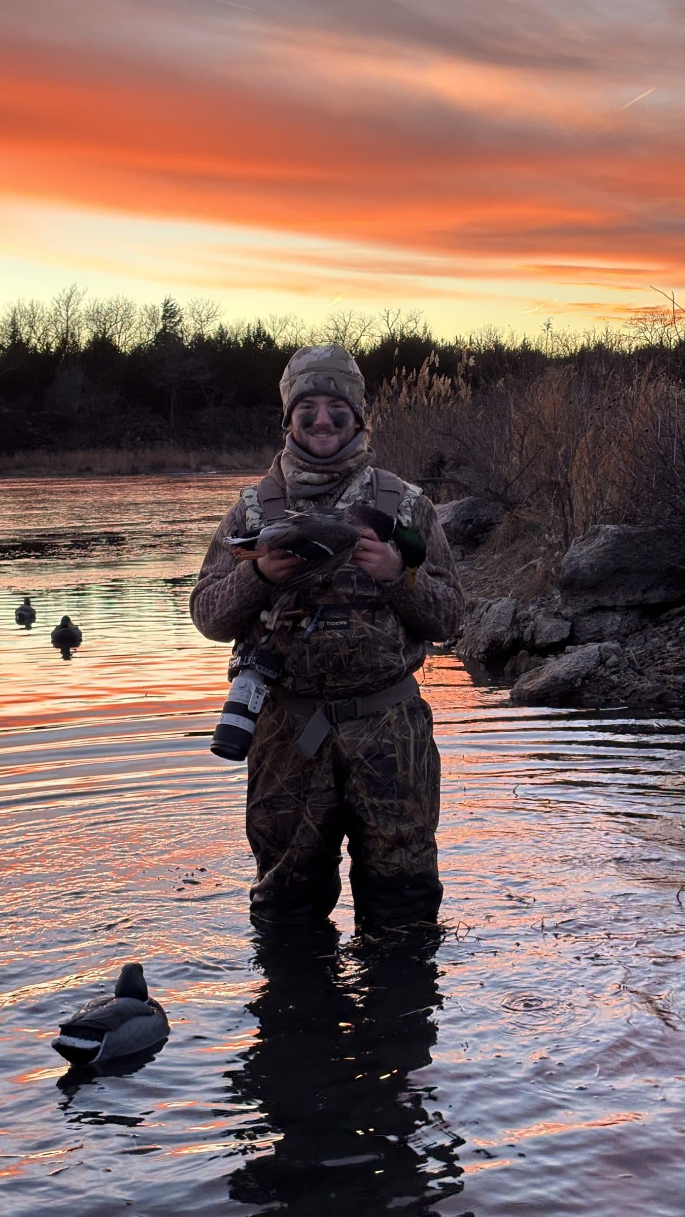 Rowe in waders at sunrise, duck hunting