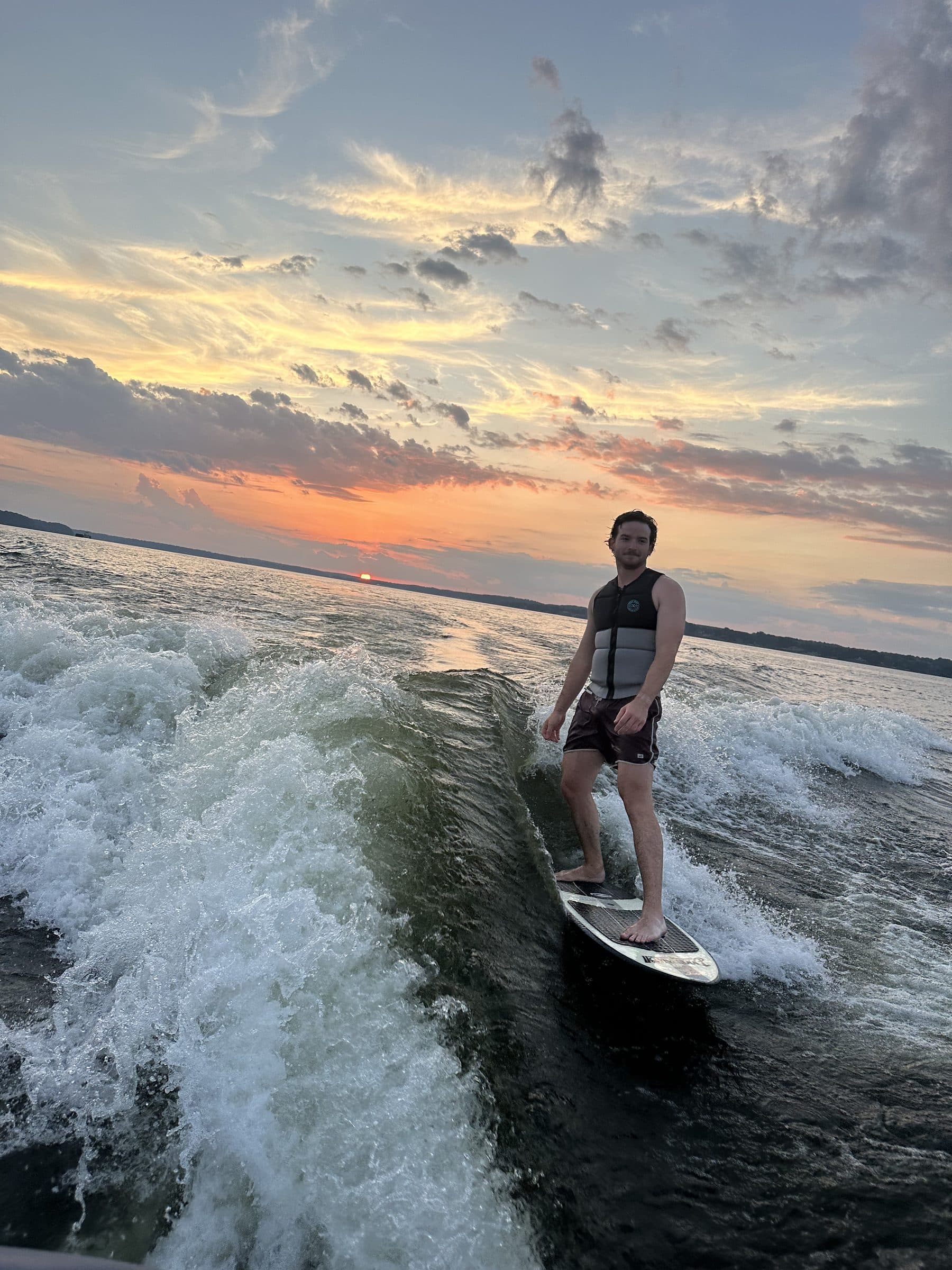 Rowe wakesurfing at sunset